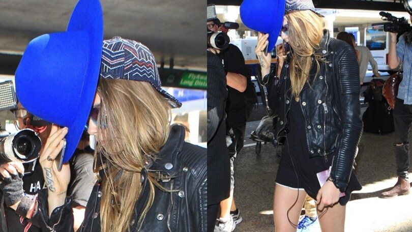 Cara Delevingne, mini short e cappello fluo