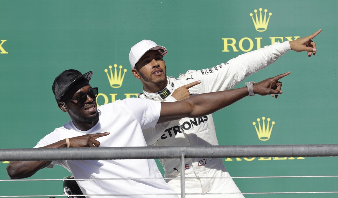 Hamilton, che festa sul podio insieme a Bolt!