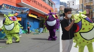In Bolivia artisti si travestono da Coronavirus