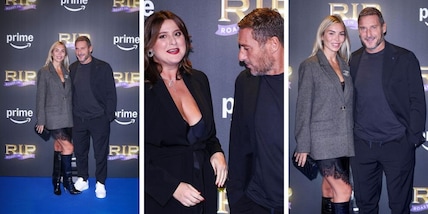 Totti show sul red carpet con Noemi in pizzo nero. E quello sguardo galeotto...