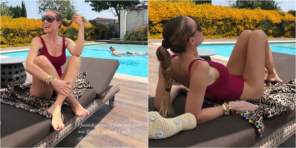 Ilary Blasi sexy, si rilassa in piscina: il costume intero è rosso fuoco